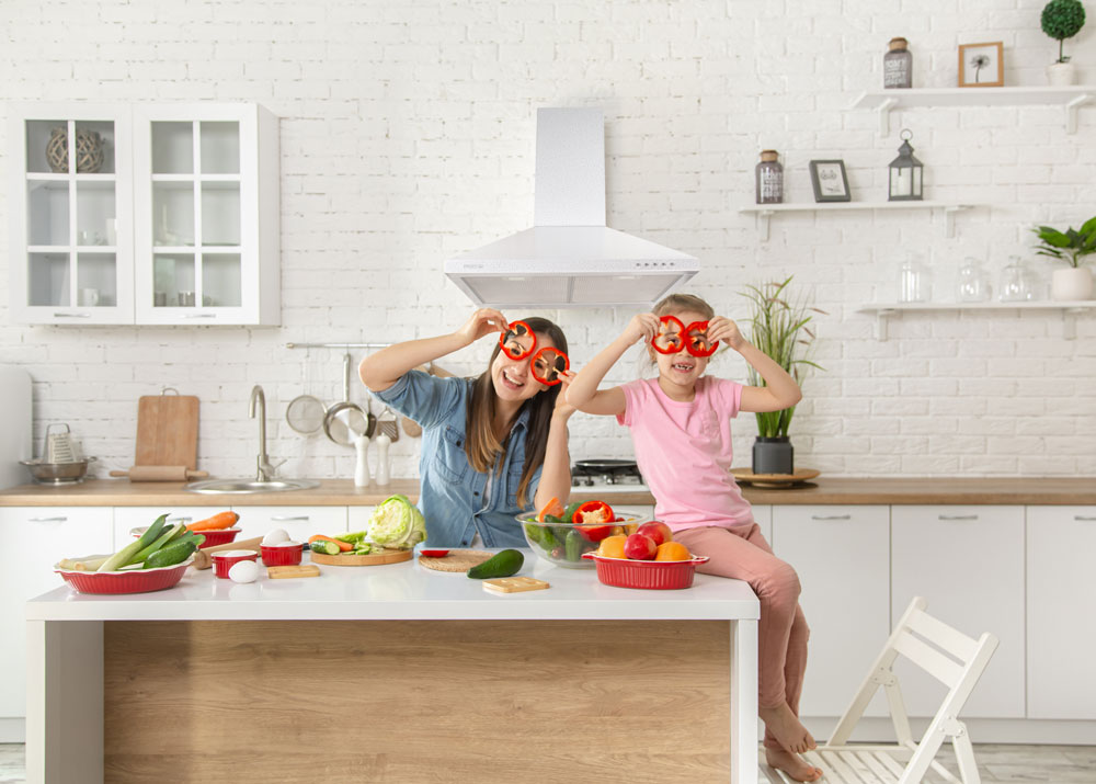 mom-daughter-prepare-salad-kitchen-have-fun-play-with-vegetables